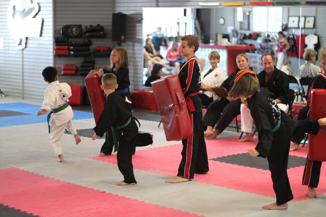 Kids mentoring other kids at karate